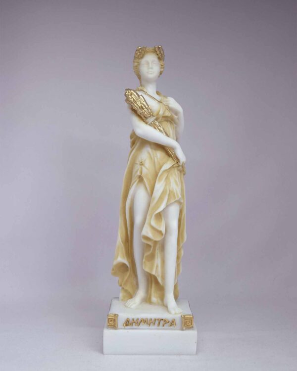 The statue of Demeter standing and holding wheat in Patina color