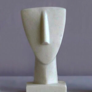 A statue of a face in Cycladic art (Type 3) in White color