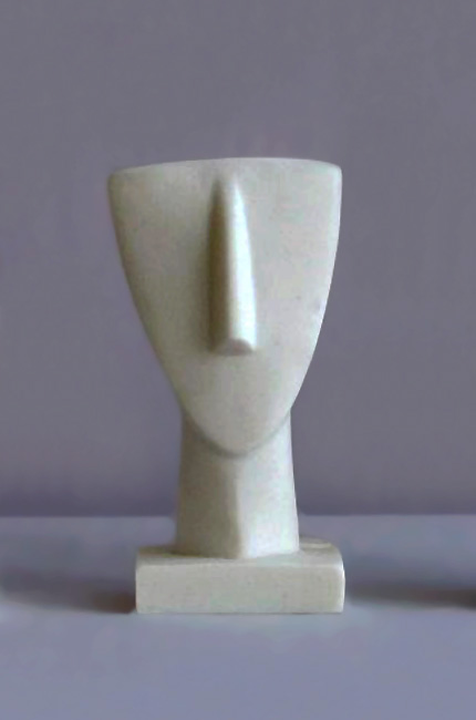 A statue of a face in Cycladic art (Type 3) in White color