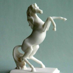 The statue of a horse whimpering with front legs in the air in White color