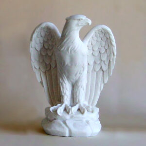The statue of an Eagle looking at right in White color