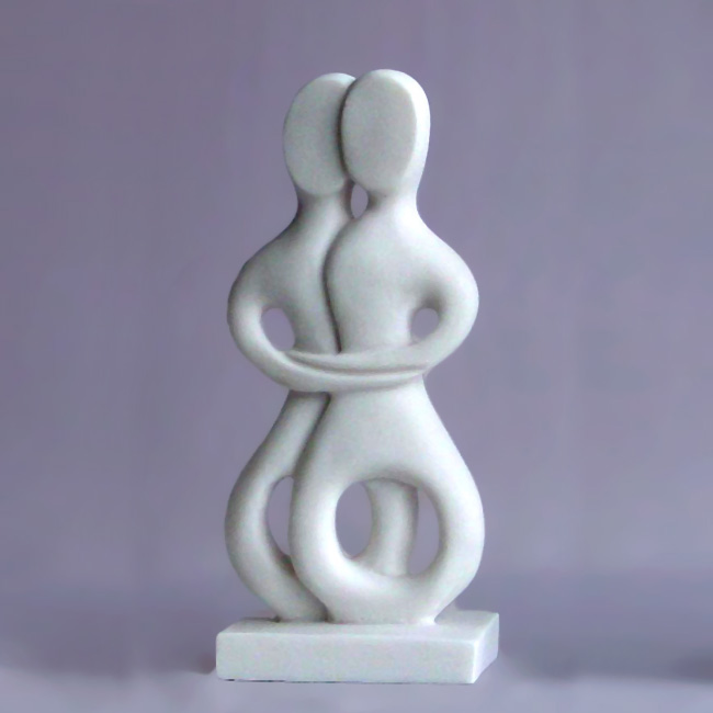 The statue of a couple who embrace each other in Cycladic Art in White color