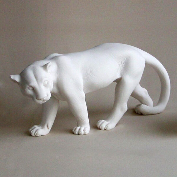 The statue of a Puma walking in White color