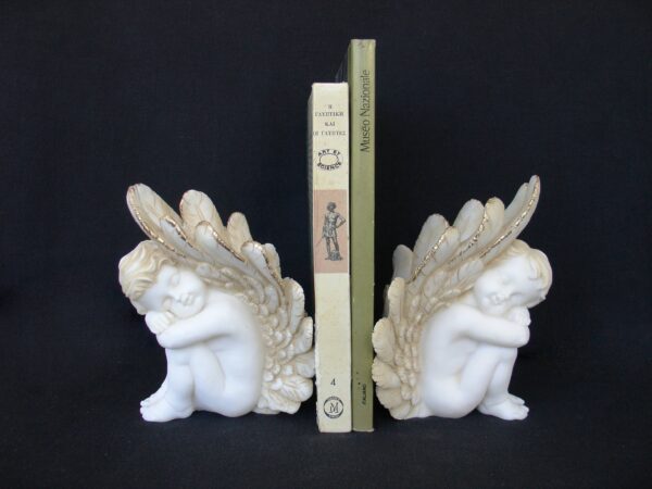 Set statues of Angels used as bookend in Patina color