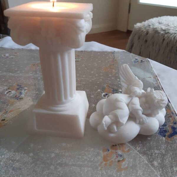 Angel sleeps on a cloud statue made of Alabaster Candle case in Ionic order full height column